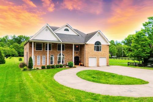 The front of the house features ample parking and inviting spots to relax and unwind.