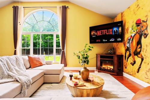 Entertainment #16: Huge Family Room with a special mural, custom bar, large TV, Fireplace, Kitchenette, attached full bathroom with steam shower and much more!!