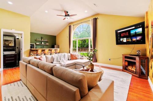 Sprawl out in this unique Bourbon themed oversized Family Room—featuring a large TV, cozy fireplace, convenient kitchenette, and an attached full bathroom with a relaxing steam shower.