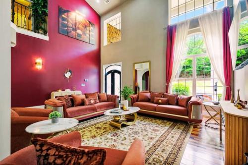 Welcome to Maya's Bluegrass Resort! Step into this beautifully renovated 7500 sq ft home with soaring ceilings, vibrant colors, and an open-concept design that creates the perfect space for both relaxation and stylish entertaining.